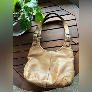 COACH tan leather handbag.
